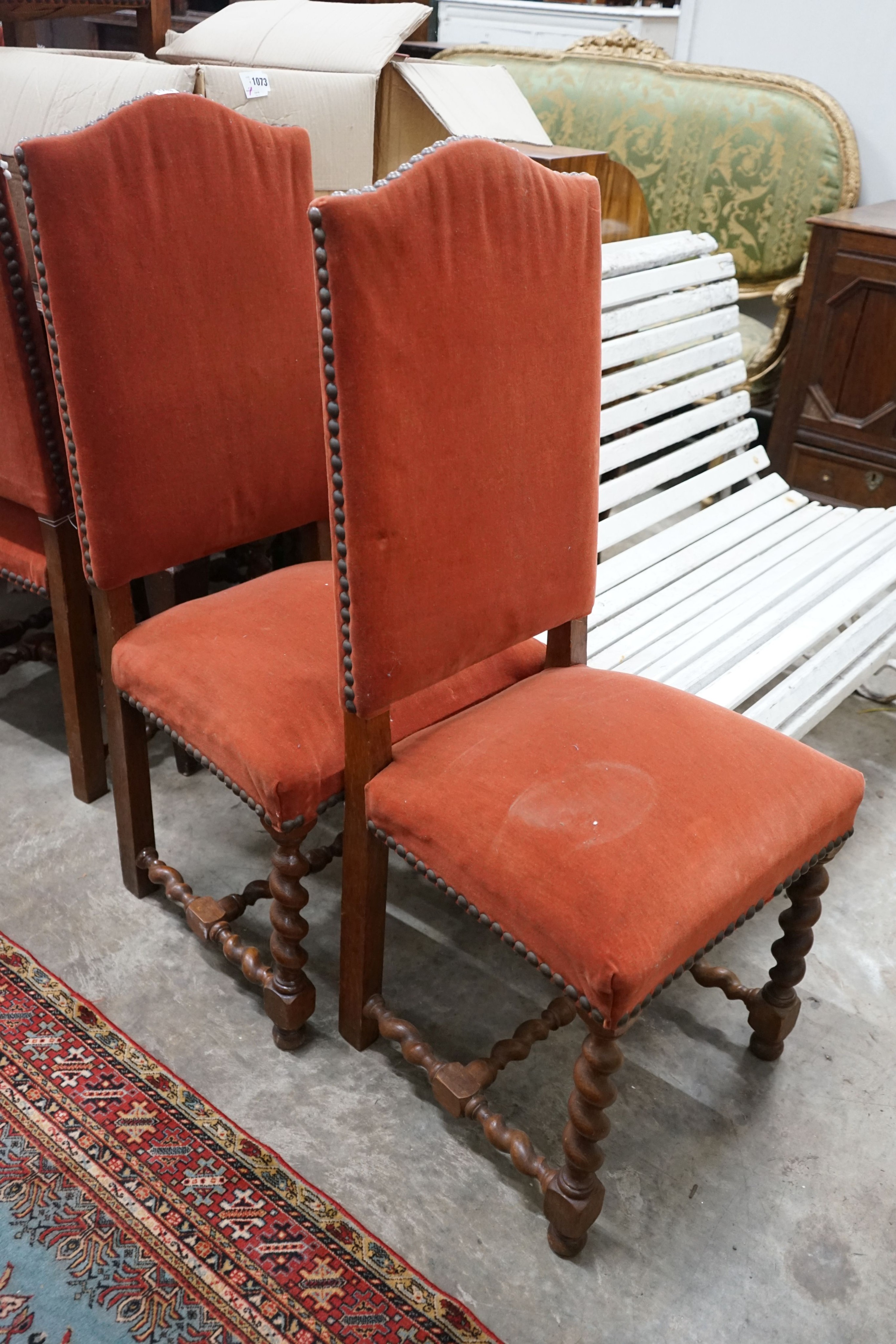 A set of ten Carolean design upholstered oak dining chairs